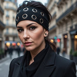 Bandeau cheveux EyeLoom noir apportant un détail graphique élégant.