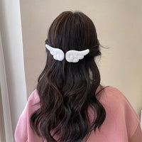 Barrette cheveux ailes d’ange blanches – style féminin vue arrière