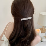 Barrette cheveux CrystalMuse assurant une queue de cheval basse élégante.