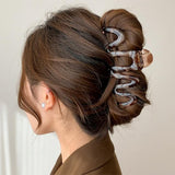 Pince cheveux SpiraHold maintenant un chignon volumineux sans glisser